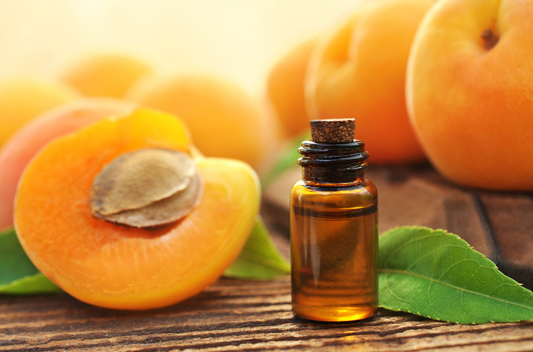 amber glass jar of apricot oil for face oil