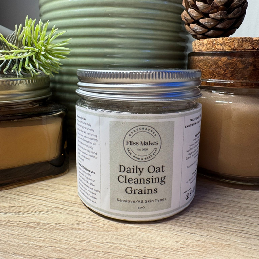 A jar of 100% natural handcrafted daily oat cleansing grains made with organic, vegan and cruelty-free ingredients, showcasing its smooth texture.