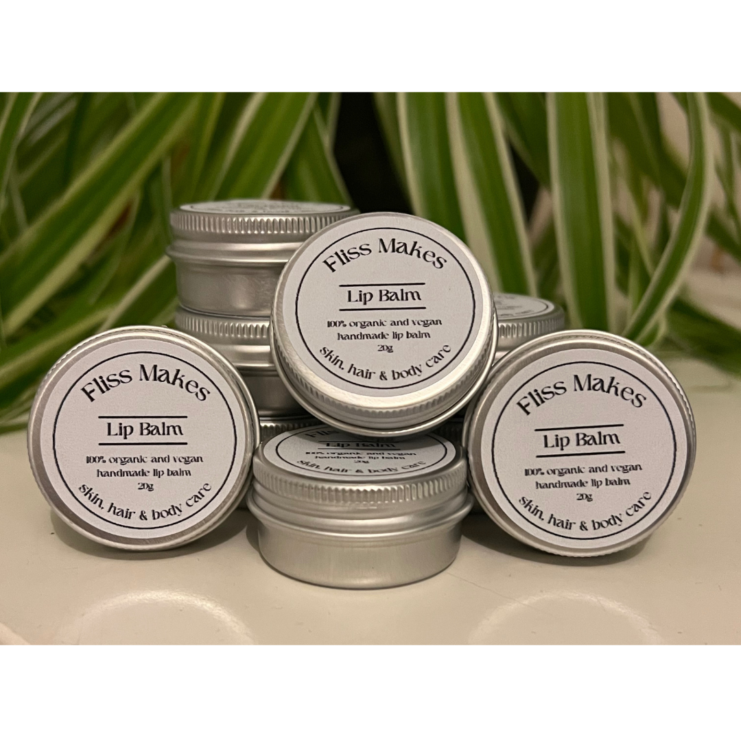 Tins of 100% natural handcrafted lip balm made with organic, vegan and cruelty-free ingredients, showcasing its smooth texture.