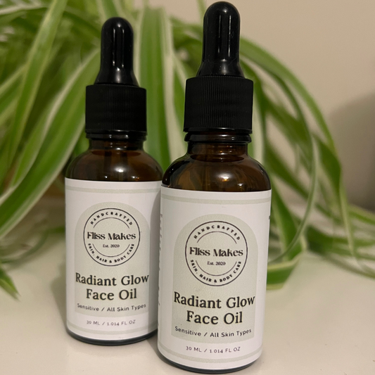 Two bottles of 100% natural handcrafted Radiant Glow Face Oil for sensitive skin made with organic, vegan and cruelty-free ingredients, showcasing its smooth texture.