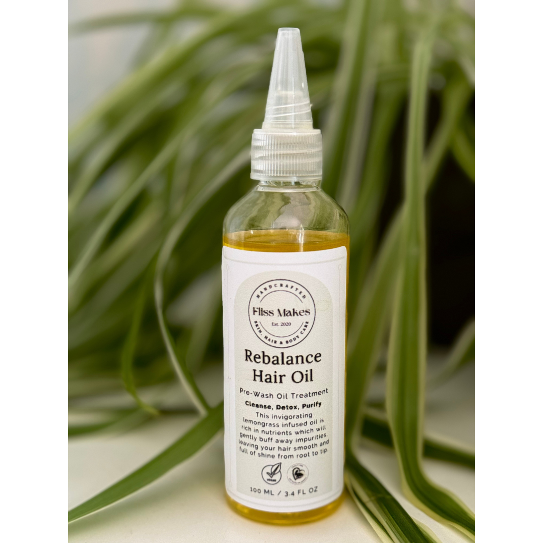 Bottle of 100% natural handcrafted Rebalance Hair Oil for oily hair made with organic, vegan and cruelty-free ingredients, showcasing its smooth texture.