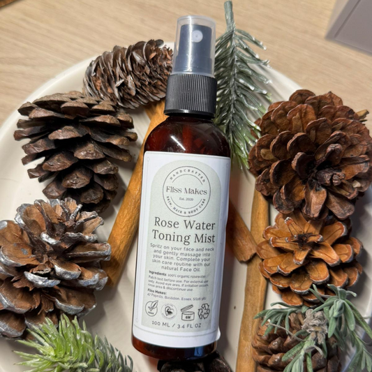 Bottle of 100% natural handcrafted Rose Water Toning Mist made with organic, vegan and cruelty-free ingredients, showcasing its smooth texture.