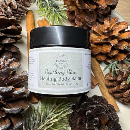 A  jar of 100% natural handcrafted Soothing Skin Healing Body Balm for eczema, psoriasis and dry skin made with organic, vegan and cruelty-free ingredients, showcasing its smooth texture. 